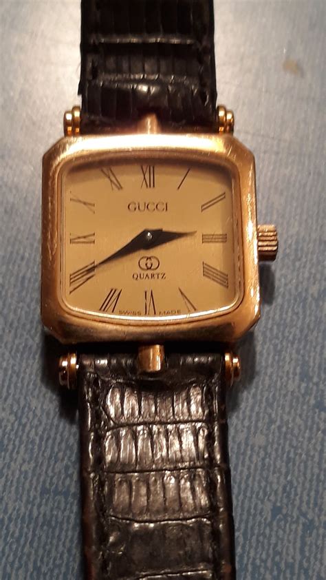 1993 gucci watch gold band black plate|Gucci Watches .